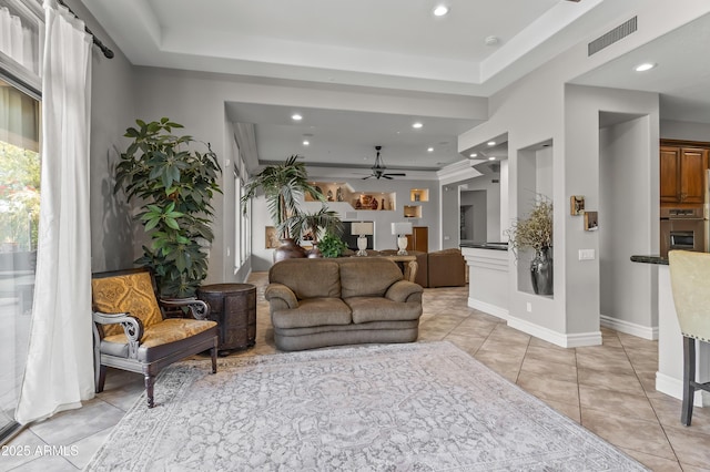 living area with light tile patterned flooring, visible vents, and recessed lighting