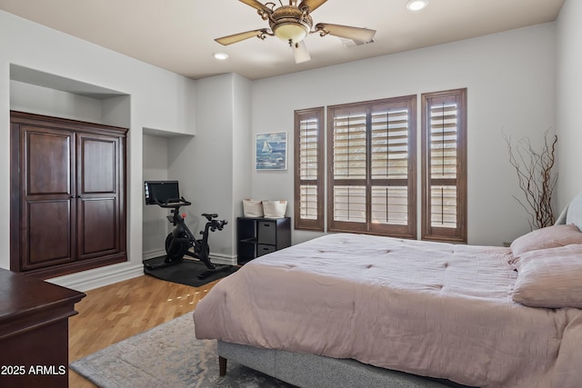 bedroom with recessed lighting, baseboards, light wood-style floors, and ceiling fan