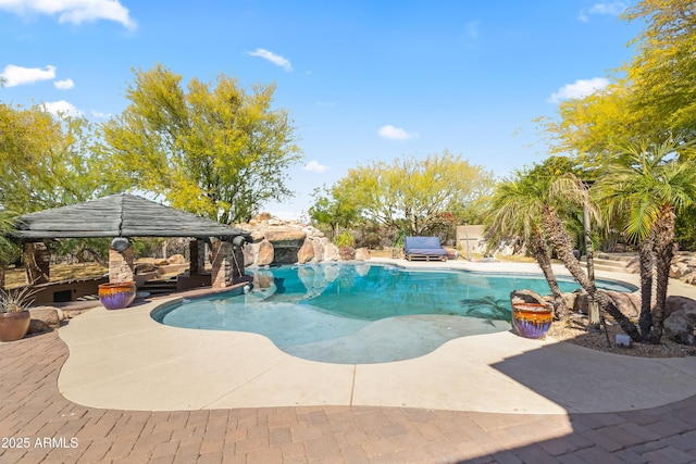 view of pool with a gazebo, a fenced in pool, a patio, and fence