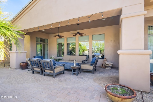 view of patio with a ceiling fan and outdoor lounge area