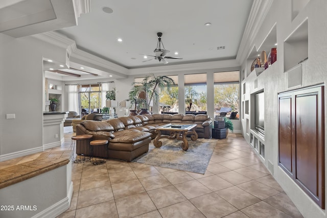 living room with light tile patterned floors, recessed lighting, crown molding, and a raised ceiling