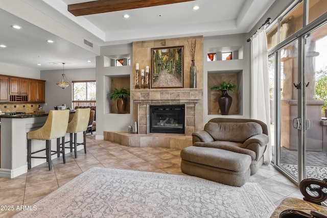 living room with visible vents, recessed lighting, a fireplace, an inviting chandelier, and light tile patterned flooring