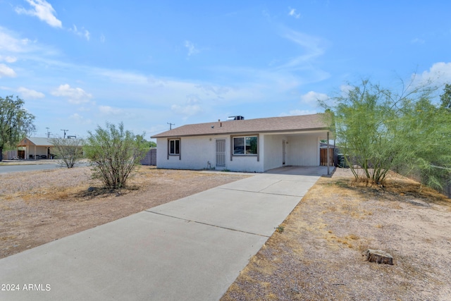 207 E Thomas St, Casa Grande, AZ 85122 - ranch-style home with driveway, an attached carport, and stucco siding