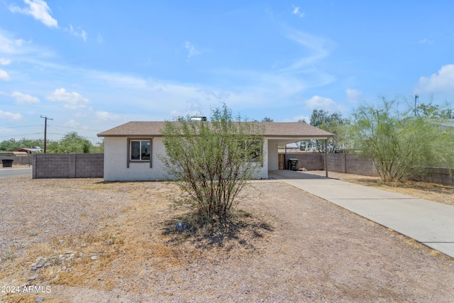 207 E Thomas St, Casa Grande, AZ 85122 - single story home featuring concrete driveway, a carport, and stucco siding
