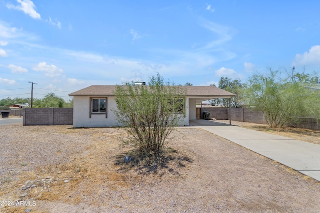 view of front of property with a carport