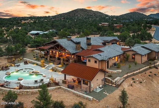 aerial view at dusk with a mountain view