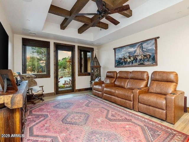 living room with ceiling fan, wood-type flooring, beam ceiling, and coffered ceiling