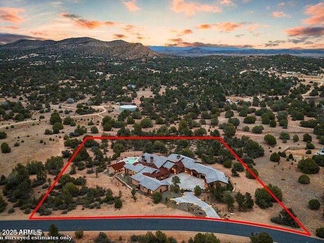 aerial view at dusk with a mountain view