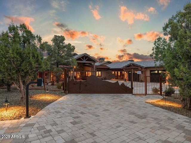 view of gate at dusk