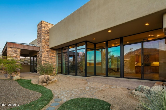 rear view of property featuring a patio