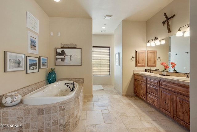 bathroom with a relaxing tiled tub and vanity