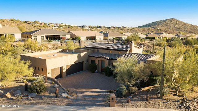 drone / aerial view with a residential view and a mountain view