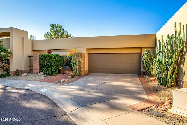 pueblo-style house with a garage