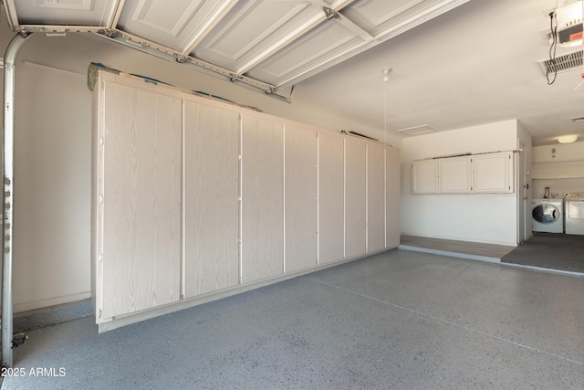 garage featuring separate washer and dryer