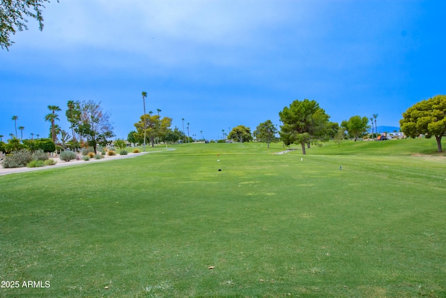 surrounding community featuring view of golf course