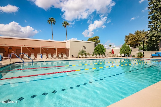 pool featuring a patio and fence