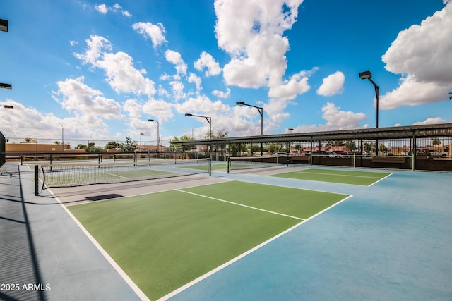 view of sport court with fence