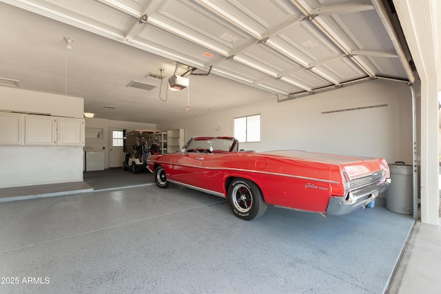 garage featuring a garage door opener