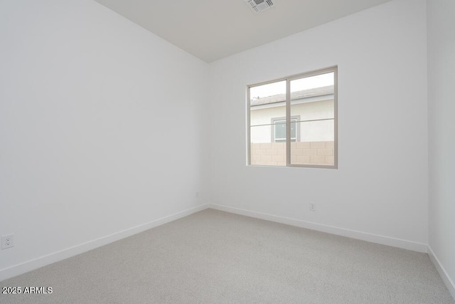 1246 E Penedes Dr, Gilbert, AZ 85298 - spare room featuring baseboards and light carpet