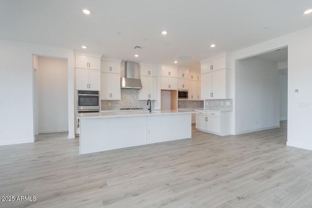 1246 E Penedes Dr, Gilbert, AZ 85298 - kitchen featuring stainless steel appliances, tasteful backsplash, an island with sink, white cabinetry, and recessed lighting