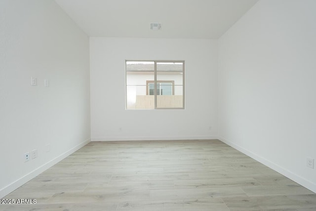 1246 E Penedes Dr, Gilbert, AZ 85298 - unfurnished room with baseboards and light wood-style floors