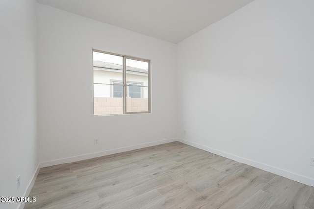 1246 E Penedes Dr, Gilbert, AZ 85298 - unfurnished room with light wood-style flooring and baseboards