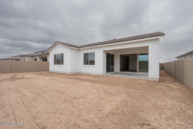 1246 E Penedes Dr, Gilbert, AZ 85298 - back of property with a patio area, a fenced backyard, and stucco siding