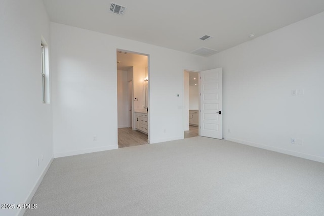 1246 E Penedes Dr, Gilbert, AZ 85298 - unfurnished bedroom featuring light colored carpet, baseboards, and ensuite bathroom