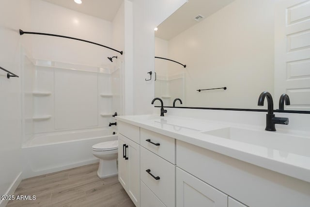 1246 E Penedes Dr, Gilbert, AZ 85298 - bathroom featuring wood finished floors, toilet, double vanity, and shower / washtub combination
