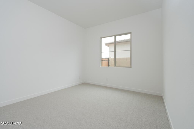 1246 E Penedes Dr, Gilbert, AZ 85298 - unfurnished room featuring baseboards and light colored carpet