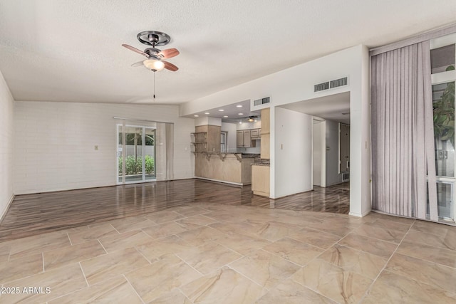 5420 N Granite Reef Rd, Scottsdale, AZ 85250 - unfurnished living room featuring ceiling fan and a textured ceiling