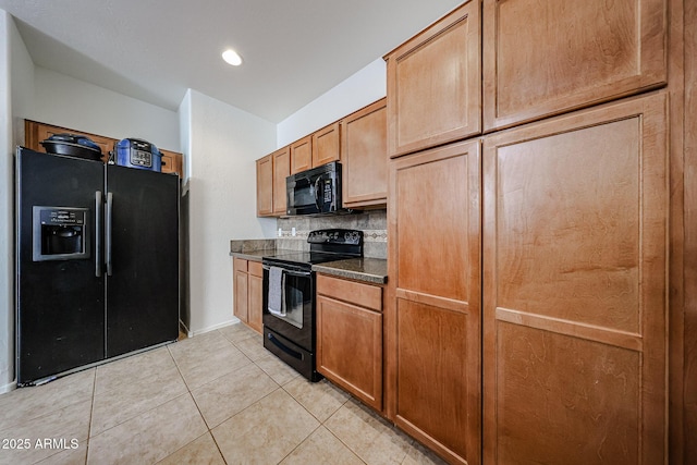 451 S Hawes Rd Unit 53, Mesa, AZ 85208 - kitchen with black appliances, dark countertops, tasteful backsplash, light tile patterned floors, and baseboards