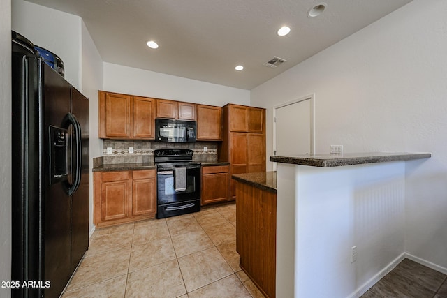 451 S Hawes Rd Unit 53, Mesa, AZ 85208 - kitchen with black appliances, brown cabinetry, decorative backsplash, a peninsula, and recessed lighting