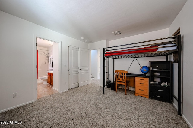 451 S Hawes Rd Unit 53, Mesa, AZ 85208 - bedroom featuring light colored carpet, baseboards, and connected bathroom