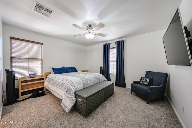 451 S Hawes Rd Unit 53, Mesa, AZ 85208 - bedroom with multiple windows, light colored carpet, ceiling fan, and baseboards