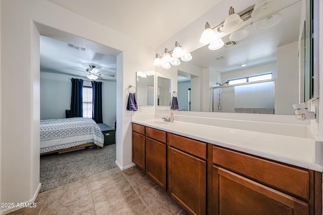 451 S Hawes Rd Unit 53, Mesa, AZ 85208 - ensuite bathroom with healthy amount of natural light, vanity, tile patterned floors, and a shower with door
