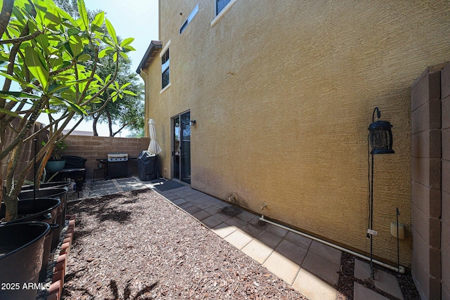 451 S Hawes Rd Unit 53, Mesa, AZ 85208 - view of home's exterior featuring stucco siding and a patio