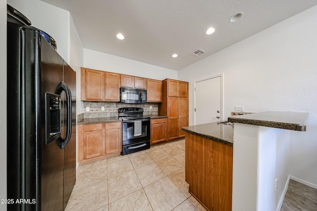 451 S Hawes Rd Unit 53, Mesa, AZ 85208 - kitchen with black appliances, a peninsula, brown cabinetry, decorative backsplash, and recessed lighting