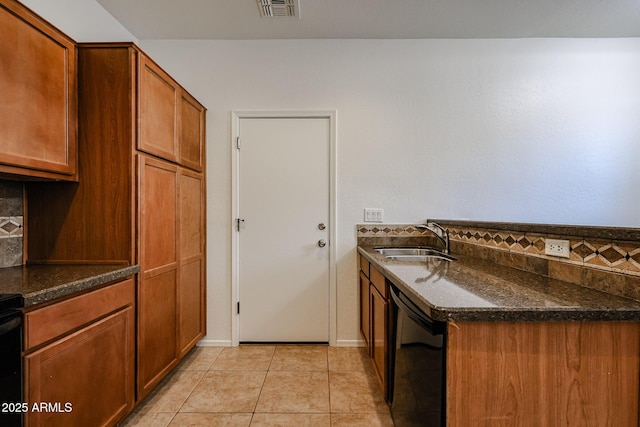 451 S Hawes Rd Unit 53, Mesa, AZ 85208 - kitchen with a sink, dishwasher, dark stone counters, and brown cabinets