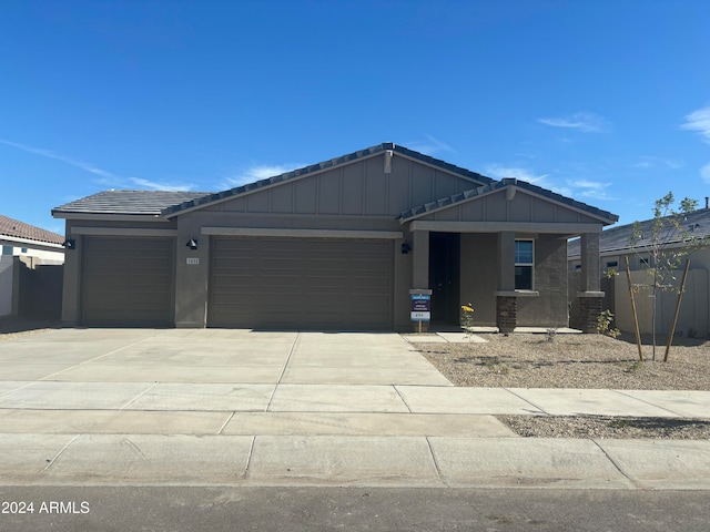 view of front of property with a garage