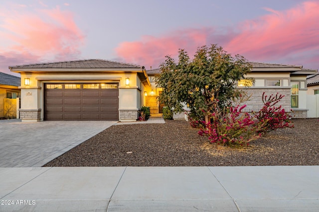 prairie-style home featuring a garage