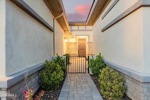 view of exterior entry at dusk