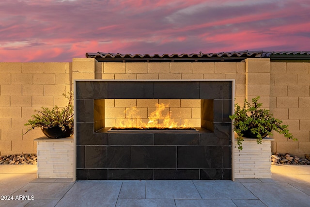 details with a tiled fireplace