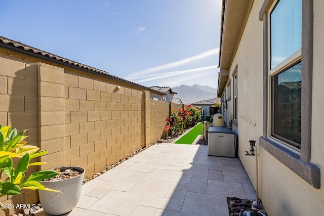 view of patio / terrace featuring a mountain view