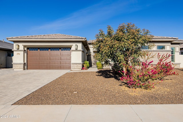 prairie-style house featuring a garage