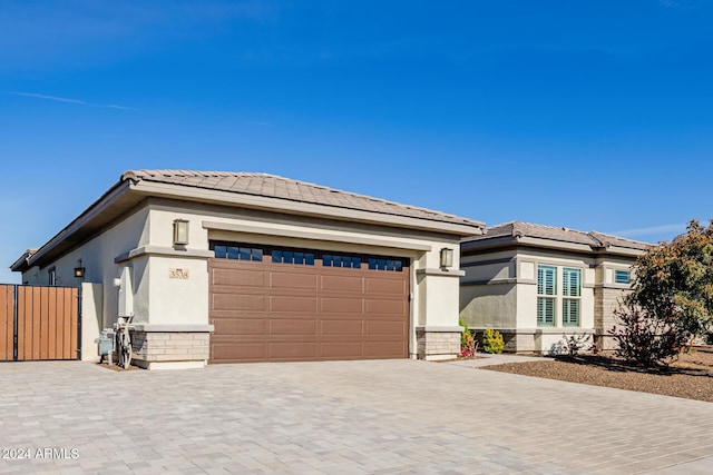 prairie-style house featuring a garage