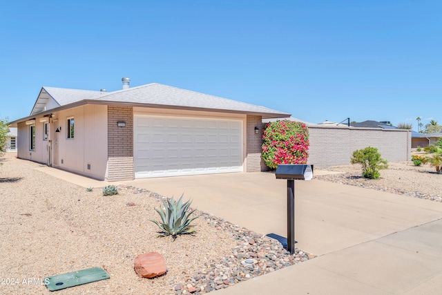 ranch-style house featuring a garage