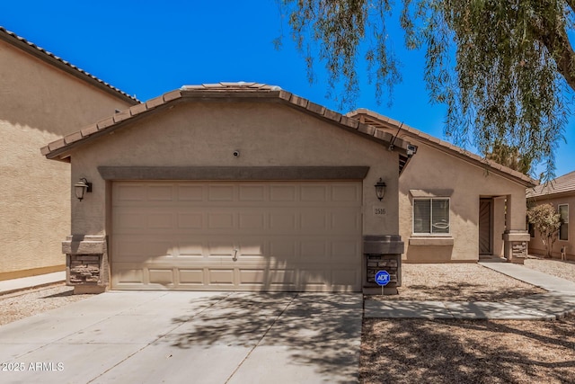 2516 E San Manuel Rd, San Tan Valley, AZ 85143 - view of front facade featuring an attached garage, driveway, and stucco siding