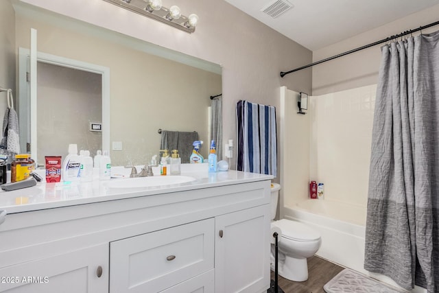 2516 E San Manuel Rd, San Tan Valley, AZ 85143 - full bath with vanity, shower / tub combo with curtain, and wood finished floors
