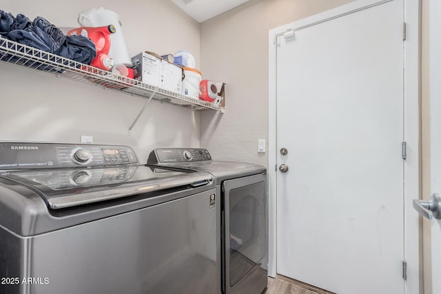 2516 E San Manuel Rd, San Tan Valley, AZ 85143 - washroom with independent washer and dryer and wood finished floors
